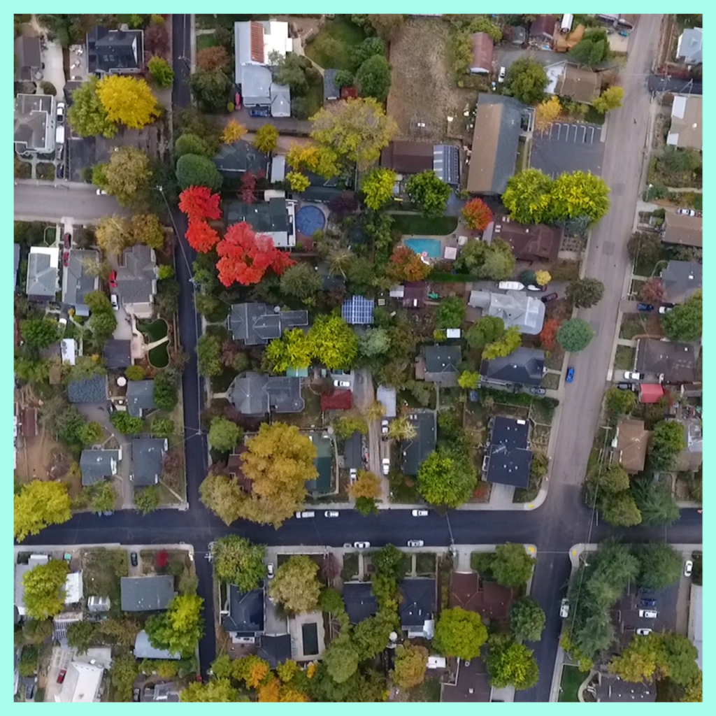 Ariel drone shot over downtown Grass Valley homes that show lots